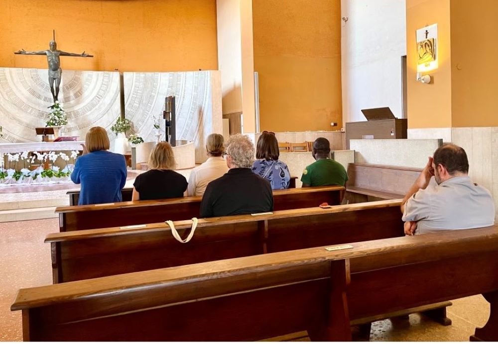 Maureen Rasmussen, Christine Zuba, Lynn Discenza and Martha Marvel pray the rosary with Fr. Andrea Conocchia in his parish in Torvaianica, a town outside Rome, on Sept. 16. (Camillo Barone) Maureen Rasmussen, Christine Zuba, Lynn Discenza and Martha Marvel pray the rosary with Fr. Andrea Conocchia in his parish in Torvaianica, a town outside Rome, on Sept. 16. (Camillo Barone)